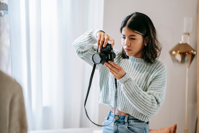 Person using a camera to take photos